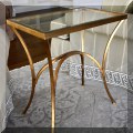 F41. Rectangular gold edge glass top side table. 